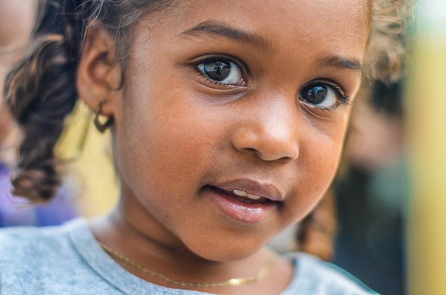 Close-up portrait of a young African girl with curly hair