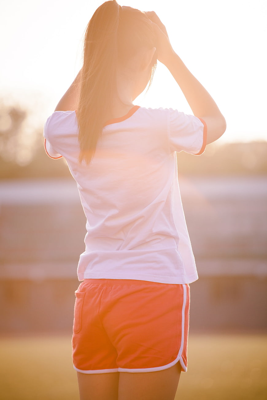 Young Woman in Sportswear at Sunset