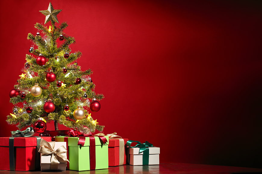 Christmas tree with gifts on red background