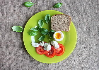 Healthy Breakfast Plate with Bread, Egg, and Tomatoes