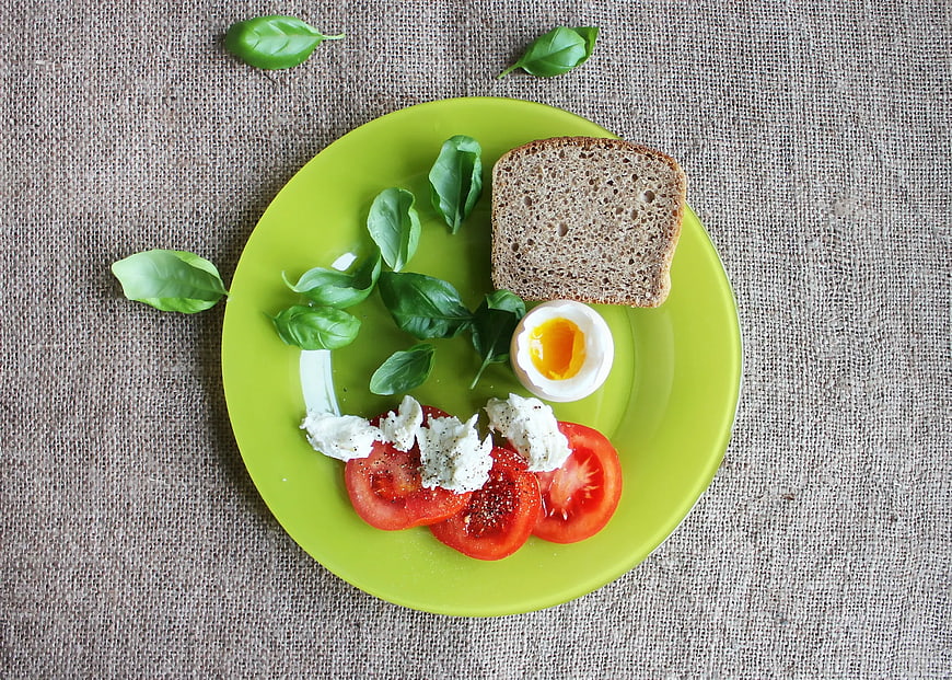 Healthy Breakfast Plate with Bread, Egg, and Tomatoes