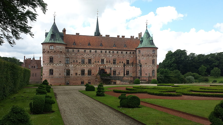 Historic Red Brick Castle with Formal Gardens and Drawbridge