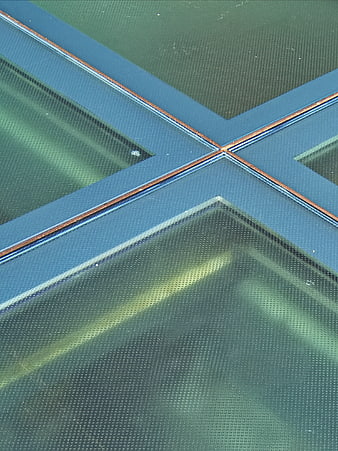 Abstract geometric glass texture with blue and green tones
