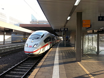 DB Intercity Express High-Speed Train Arriving at German Railway Station Platform