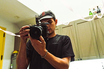 Young Filmmaker Filming Mirror Selfie with Cinema Camera