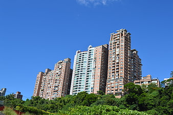 High-rise residential buildings against a clear blue sky