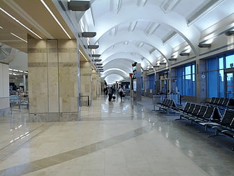 Spacious Airport Terminal Hallway with Arched Ceiling