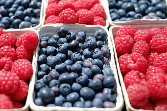 Fresh Raspberries and Blueberries in White Containers