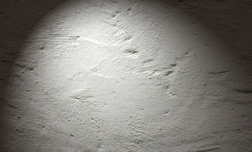 Textured White Plaster Wall With Spotlight Illumination