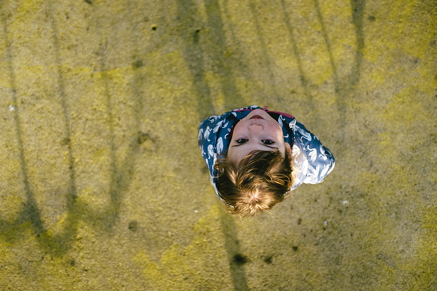 Top-down view of a child looking up at the camera