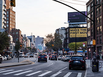 Busy Manhattan Street Scene with Traffic and Billboards