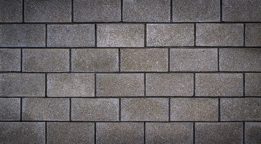 Textured gray stone brick wall pattern background