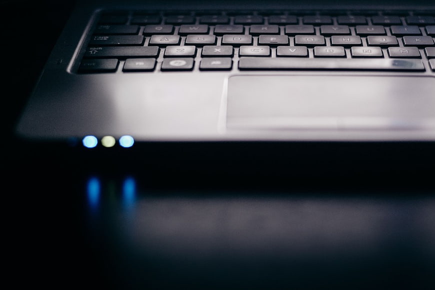 Closeup of Laptop Keyboard and Trackpad in Dark Setting
