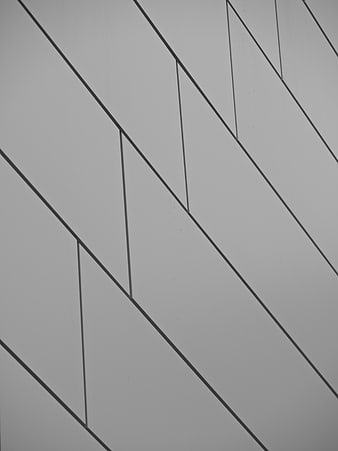 Abstract Geometric Pattern on Gray Industrial Wall