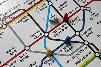 London Underground Map With Board Game Pieces And Dice