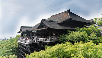 Kiyomizu-dera Temple in Kyoto Japan with Crowds and Green Foliage