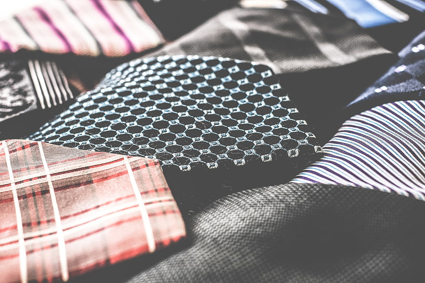 Close-up of various patterned neckties and fabric textures