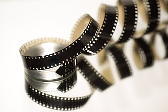 Vintage 8mm film strip unspooled on white background