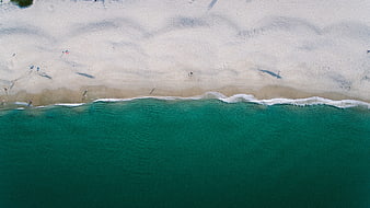 Aerial View of Turquoise Ocean Waves Meeting White Sandy Beach