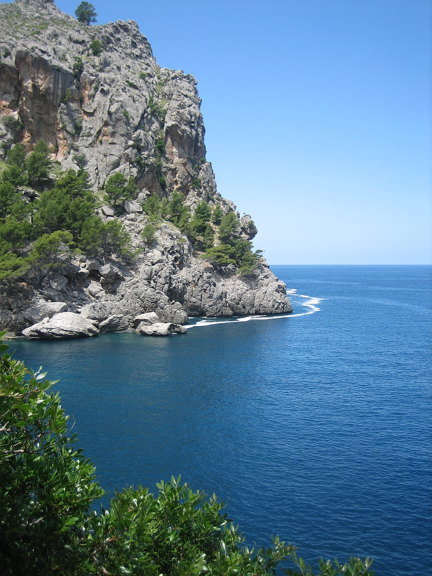 Rugged coastal cliffs meeting deep blue Mediterranean sea