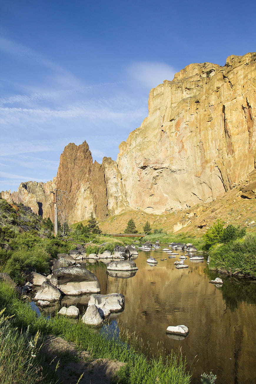 Serene River Flowing Through Rocky Canyon Landscape