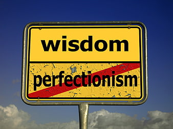 Wisdom vs Perfectionism Road Sign Concept