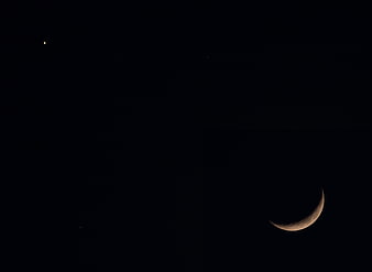 Crescent Moon and Star in Dark Night Sky