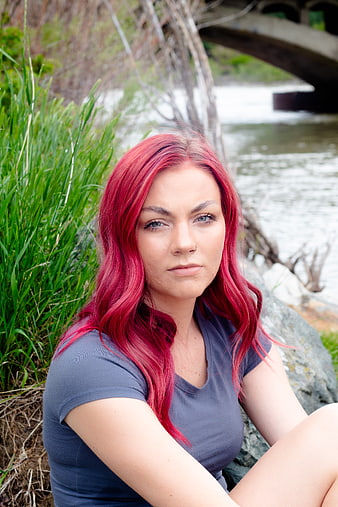 Portrait of Woman with Red Hair Sitting by River