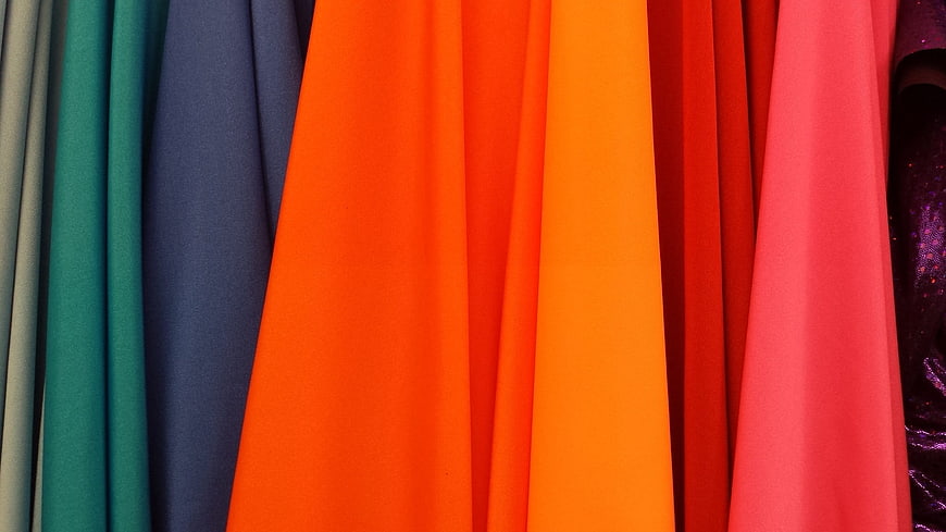 Vibrant Colorful Fabric Swatches Hanging in Vertical Rows