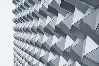 Modern geometric architectural facade with repeating triangular patterns