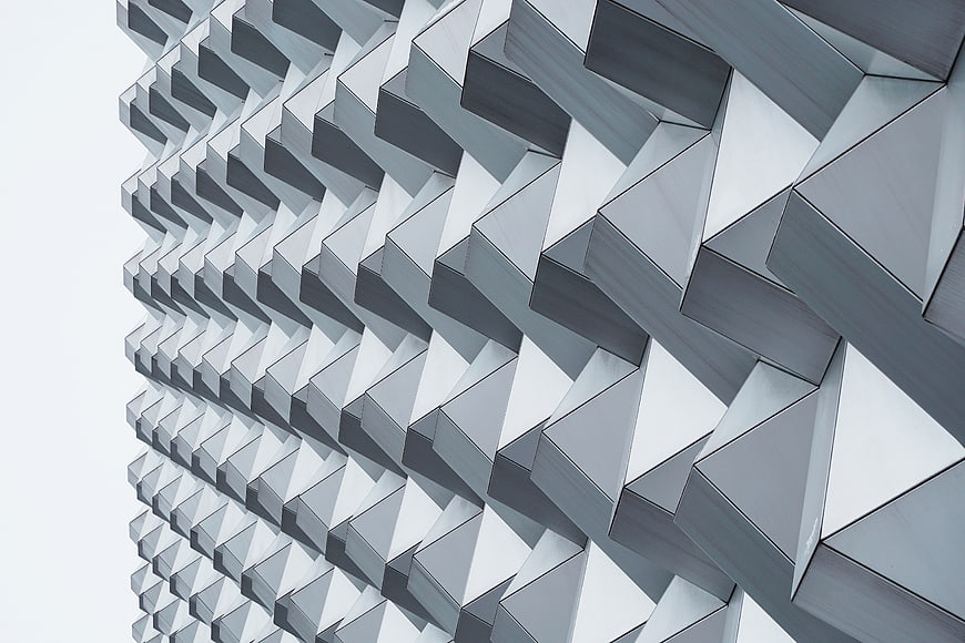 Modern geometric architectural facade with repeating triangular patterns