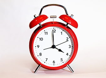 Red Vintage Alarm Clock on White Background