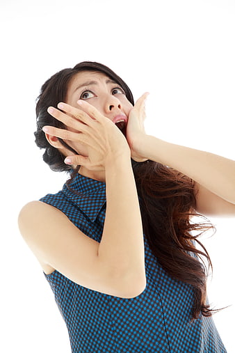 Shocked Asian Woman Screaming with Hands on Face