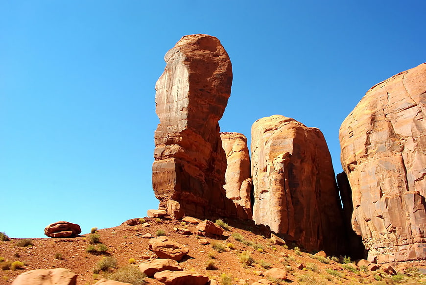 Towering Red Rock Formations Against Clear Blue Sky