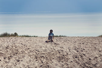 Toddler Crawling Up Sand Dune Beach