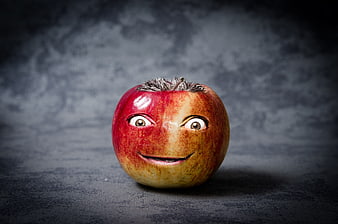 Funny anthropomorphic apple with human face and hair