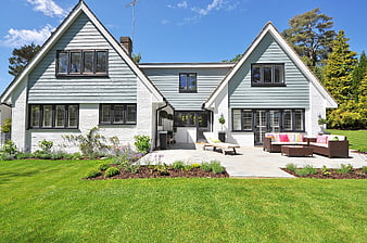 Modern New England style home with patio and garden