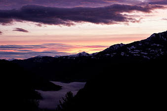 Dramatic Winter Mountain Sunrise With Valley Fog And Snow