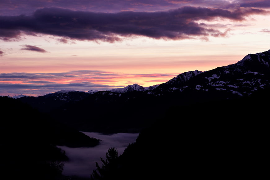 Dramatic Winter Mountain Sunrise With Valley Fog And Snow