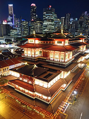 Illuminated Buddha Tooth Relic Temple at Night in Singapore