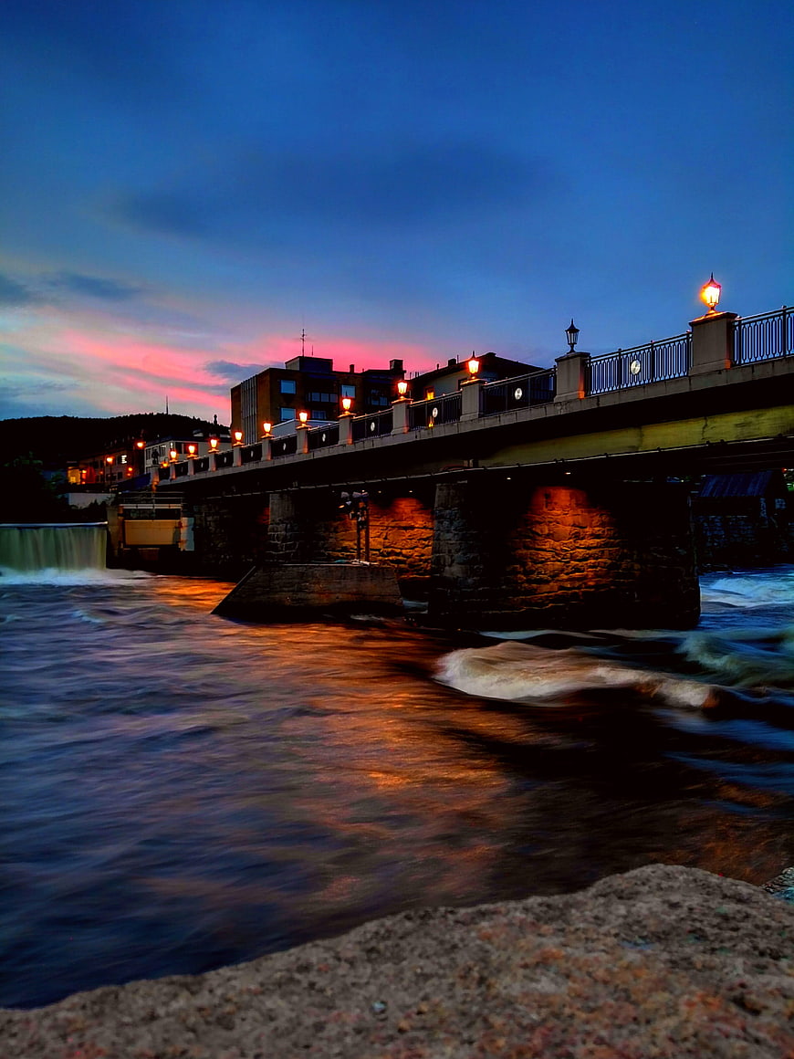 Long Exposure Bridge at Dusk Over Flowing River