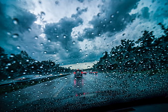 Rainy Highway Drive Through Stormy Clouds