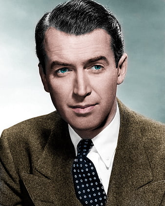 Vintage color portrait of actor James Stewart in brown suit