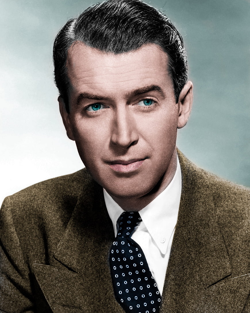 Vintage color portrait of actor James Stewart in brown suit