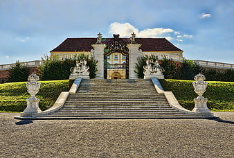 Grand Baroque Palace Entrance With Ornate Staircase And Sculptures
