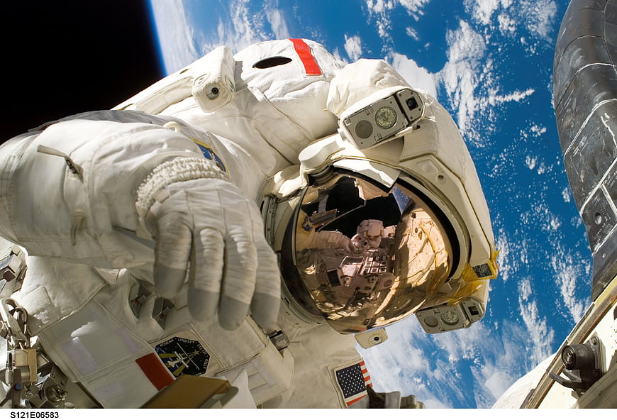 Astronaut Spacewalk with Earth and Reflection in Helmet