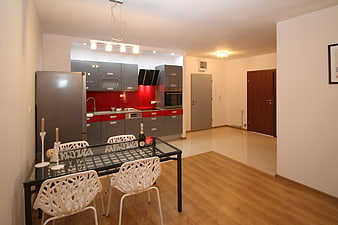 Modern Apartment Interior With Gray And Red Kitchen Cabinetry