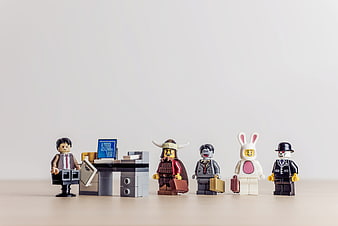 Lego Minifigures in Business Attire Waiting in Line at Office Desk