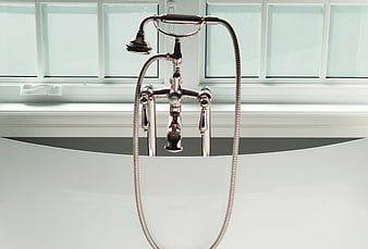 Chrome Bathtub Faucet And Shower Head In Modern White Bathroom