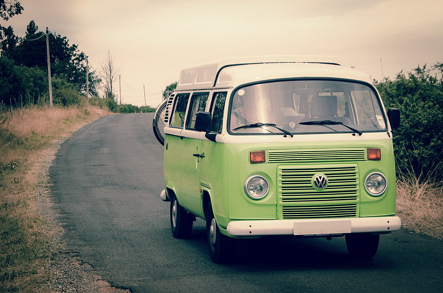 Vintage Green VW Camper Van on Rural Road